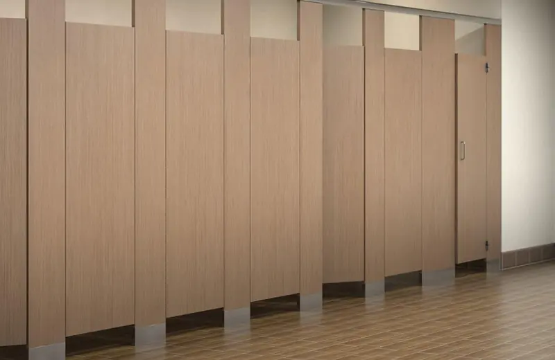 Photo of light oak wood patterned high pressure laminate bathroom partitions