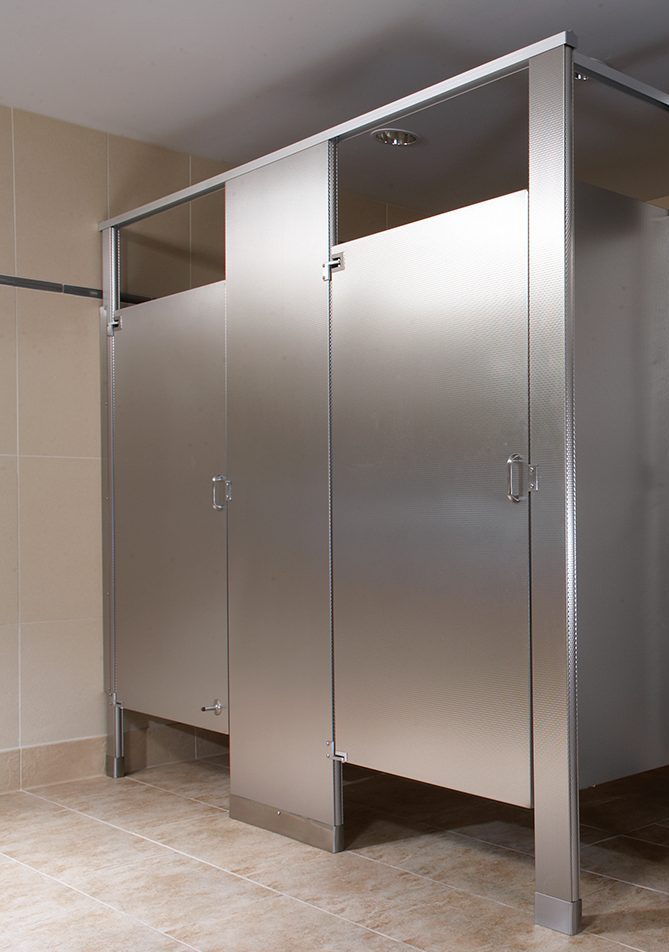 Stainless steel toilet partitions in a commercial restroom