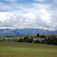 Photograph of pastoral landscape, with mountains, outside of Spokane, Washington.