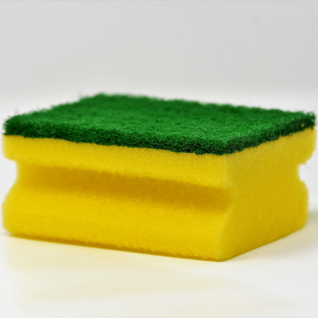 Use soft, non-abrasive sponges and cloths to clean high pressure laminate. Photograph of yellow and green sponge.