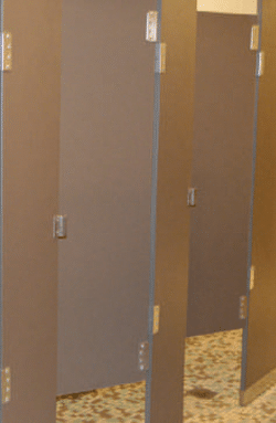 Solid plastic dressing stalls with doors. Photo of gray dressing compartment with doors.