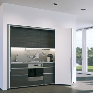 Rendering of a Hawa Concepta Folding/Sliding Door system concealing a kitchenette.
