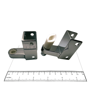 Photograph of hinge components from Bobrick In-Swing Door Hardware Kit - 1002038, with ruler.