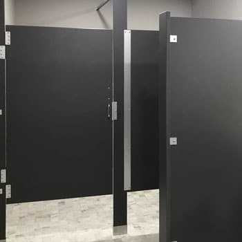 Photograph of HDPE solid plastic partitions from Scranton Products. Scranton produces matching HDPE vanities.