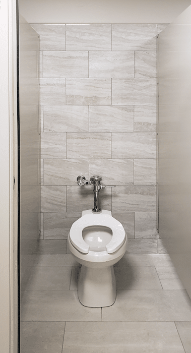 Photograph of an individual Elite Plus toilet stall, showing continuous brackets and low mounting height.