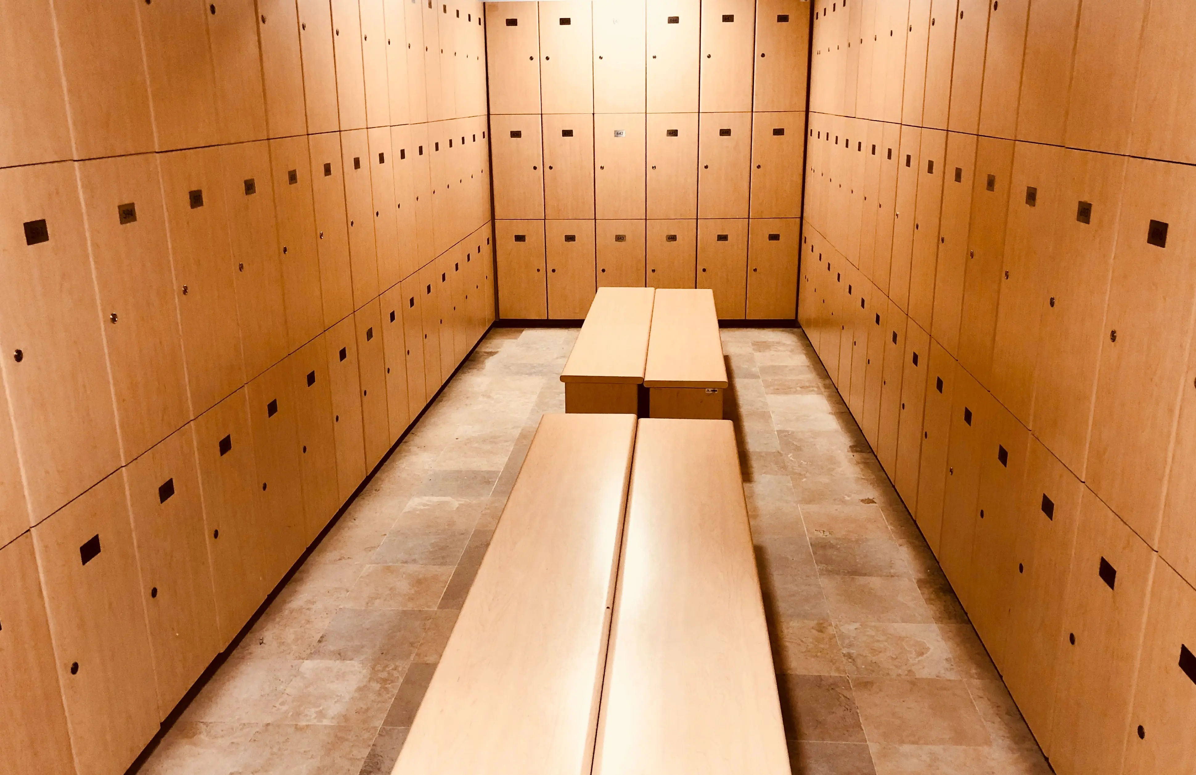 Wooden Lockers and Benches inside Locker Room