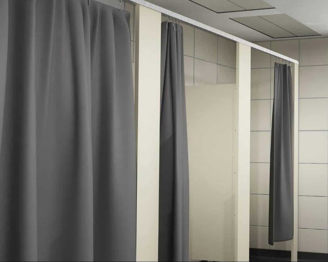 Cream colored solid plastic HDPE dressing compartments with grey curtains