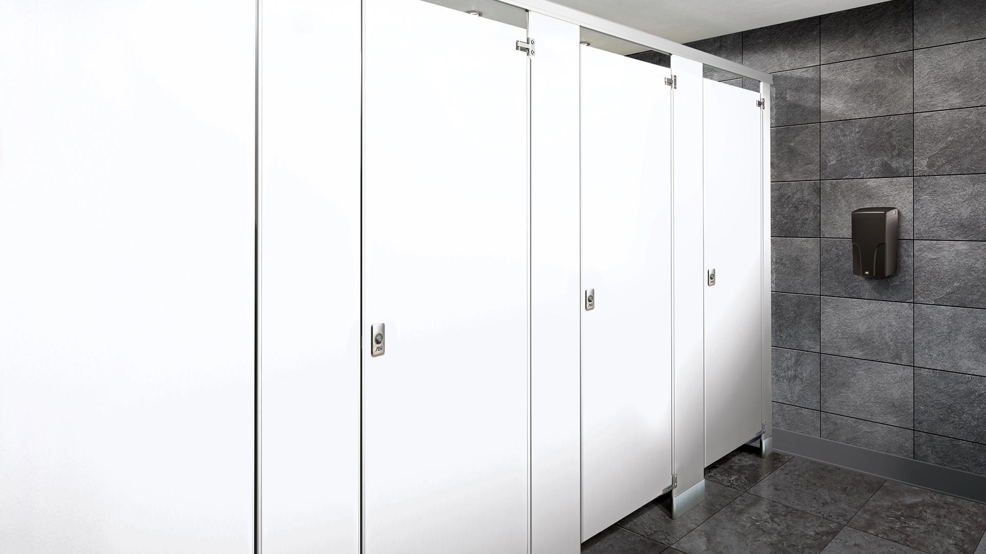 White ASI Powder Coated Steel Stalls in Grey Tiled Bathroom with black soap dispenser on the wall