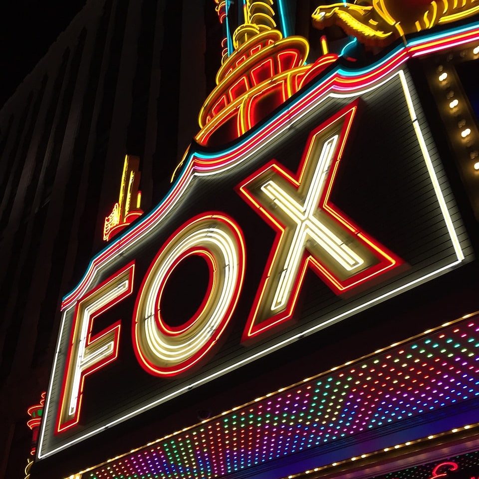 Photograph of neon sign reading “Fox” outside Detroit’s Fox Theater.